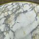 Round bistro table with a central pedestal, gold marble effect and black steel, 60cm.
