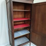 Bonnetière man standing cabinet a door