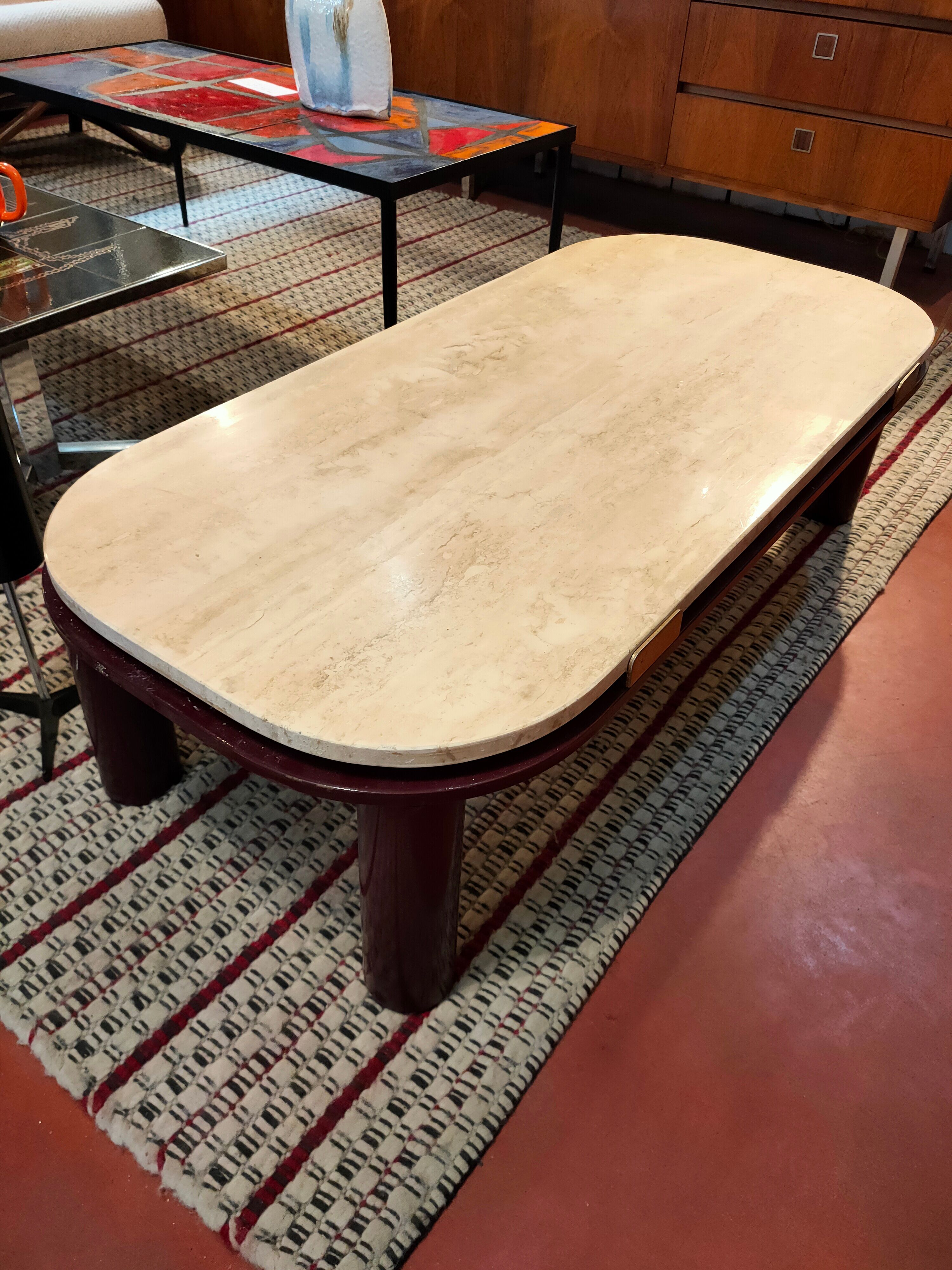 Coffee table Travertine top, garnet-colored metal stand and legs.  Long
