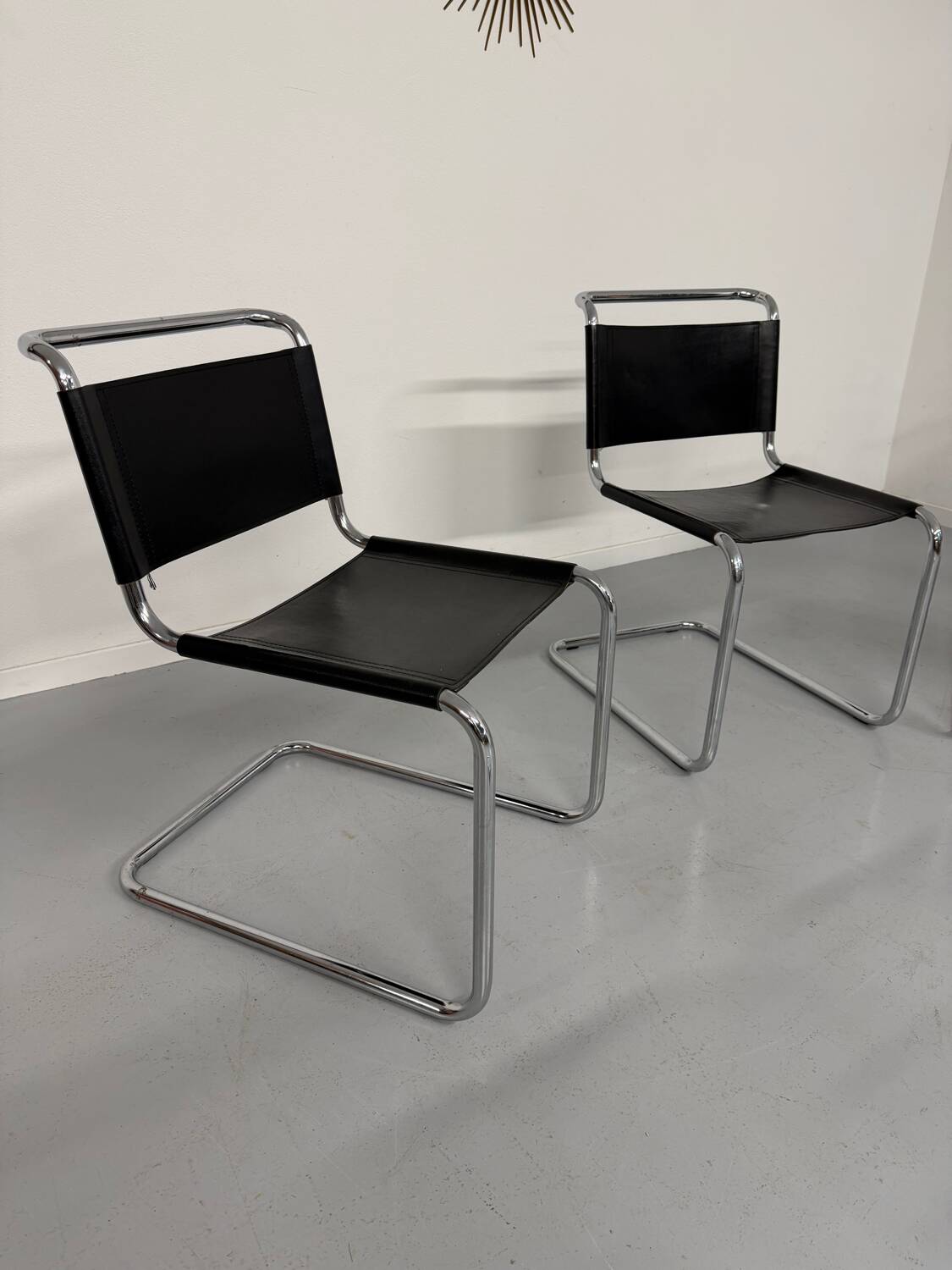 Lot of 4 tubular chairs designed by Mart Stam in vintage black leather from the 1980s.