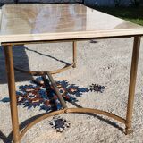 Living room table in gilded metal and marble.
