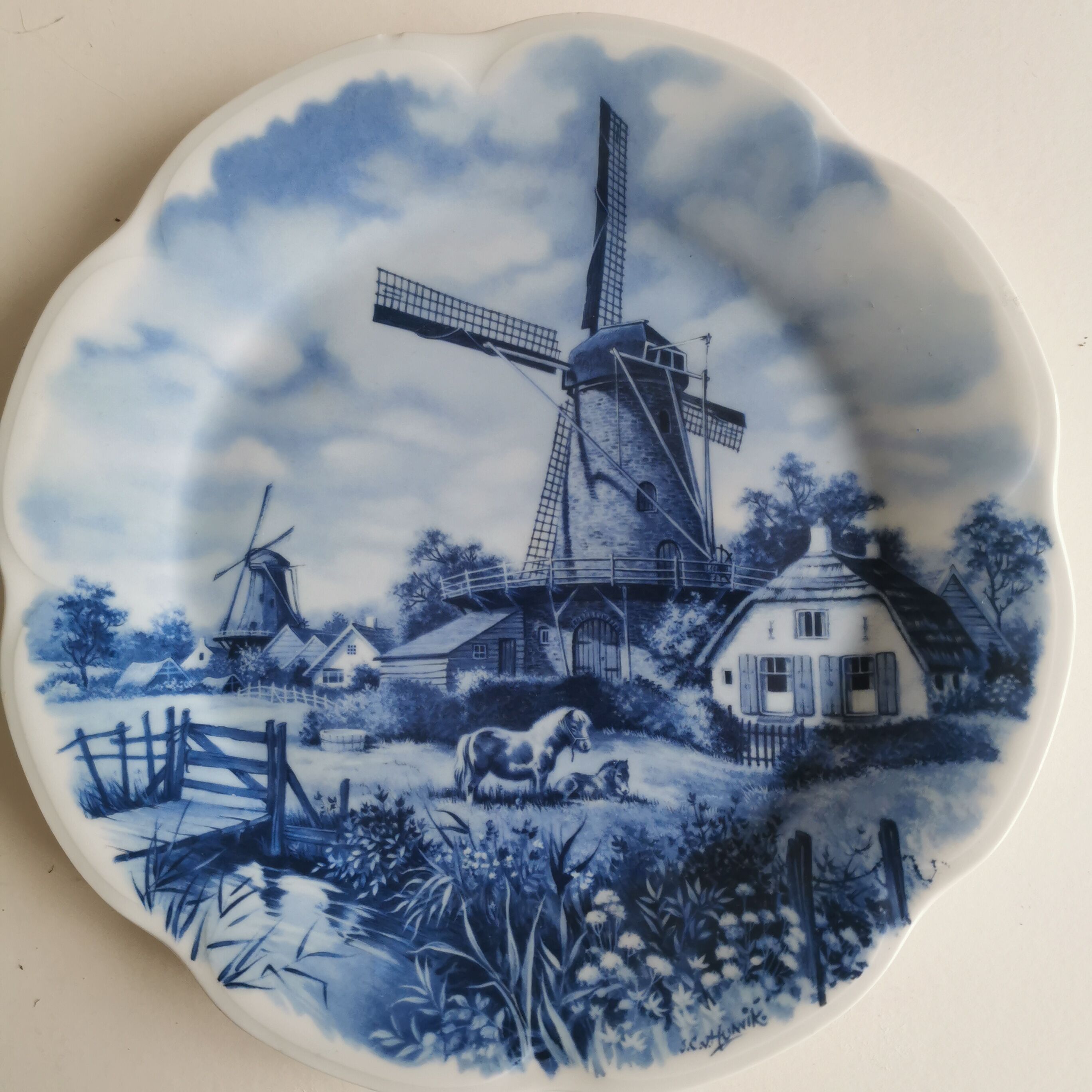 Decorative plate stamped Delft Blauw, made by Eschenbach in Germany