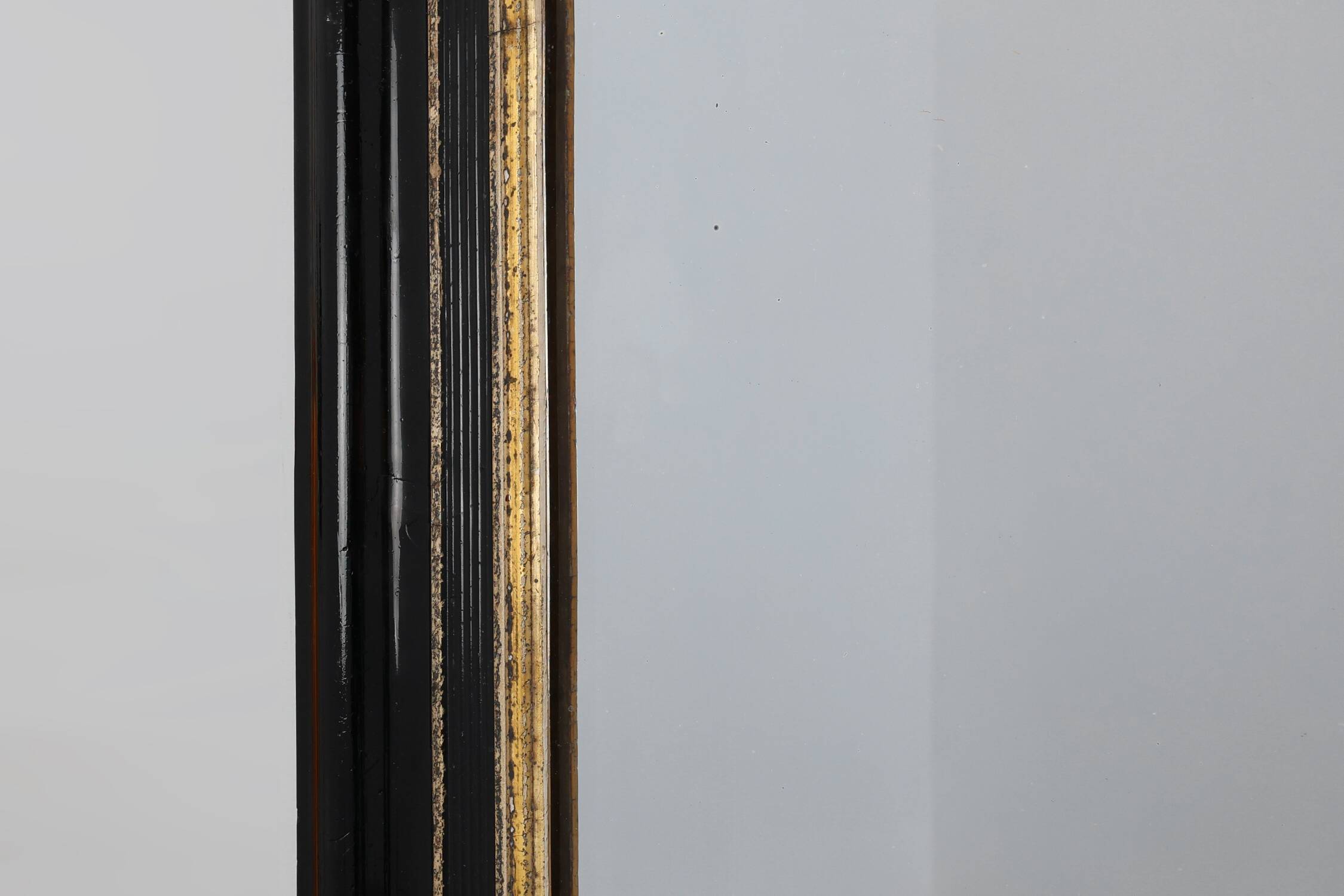 Black laquered and gilted wooden Louis Philippe mirror, France ca. 1850