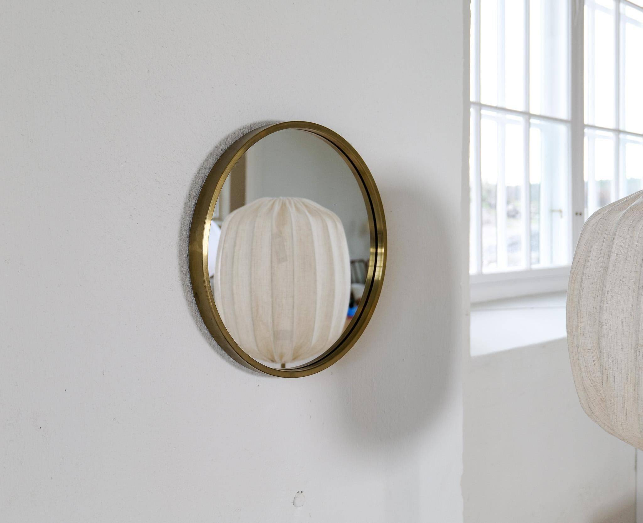Round brass mirror from the mid-century by Glasmäster in Markaryd, Sweden, 1960s.