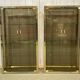Pair of display cases in gilded chrome and smoked glass - 1980s