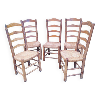Series of rustic wood and straw farm chairs