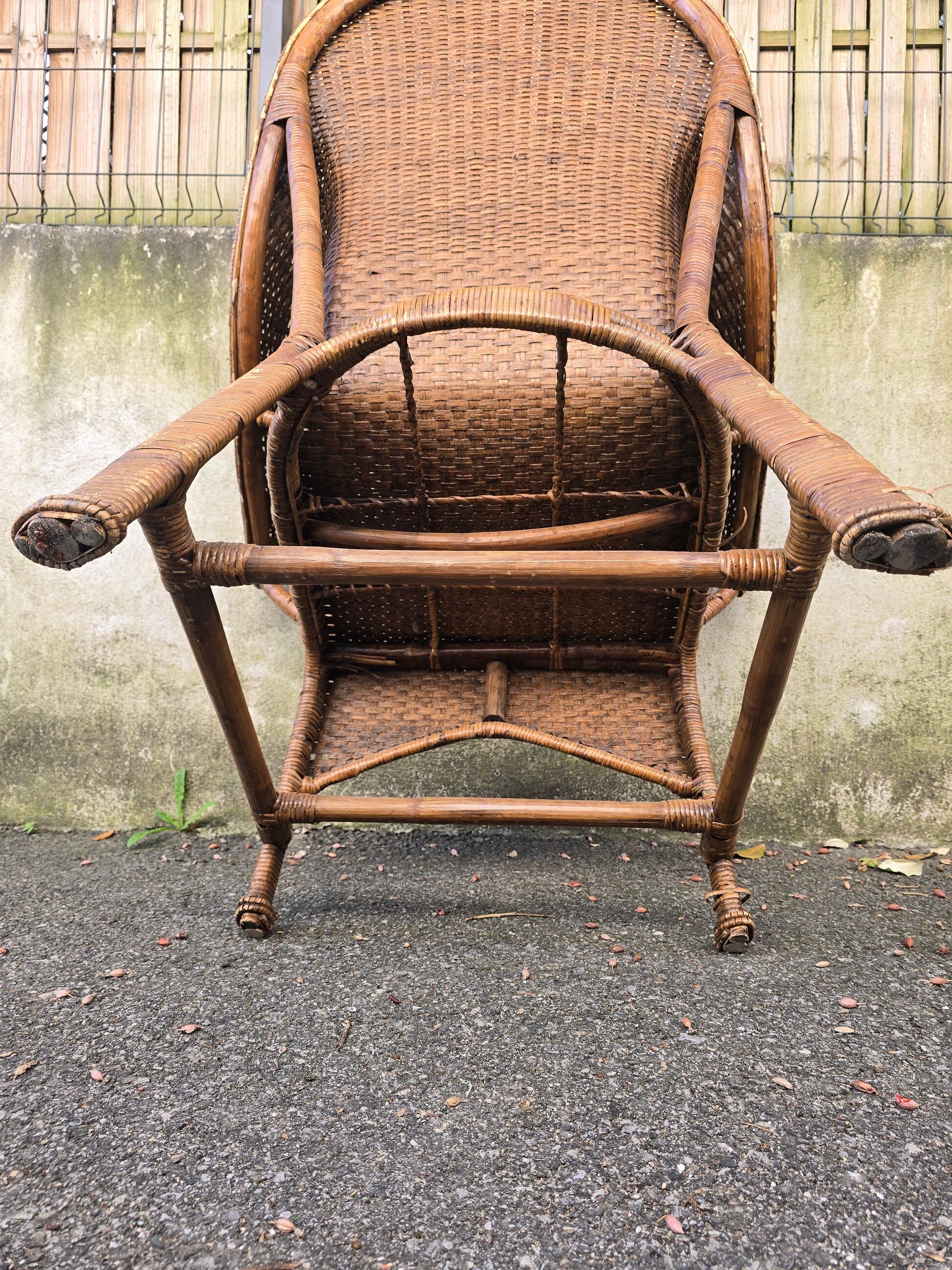 Arts & Crafts armchair in wicker and rattan attributed to Dryad & Co, UK, circa 1920.