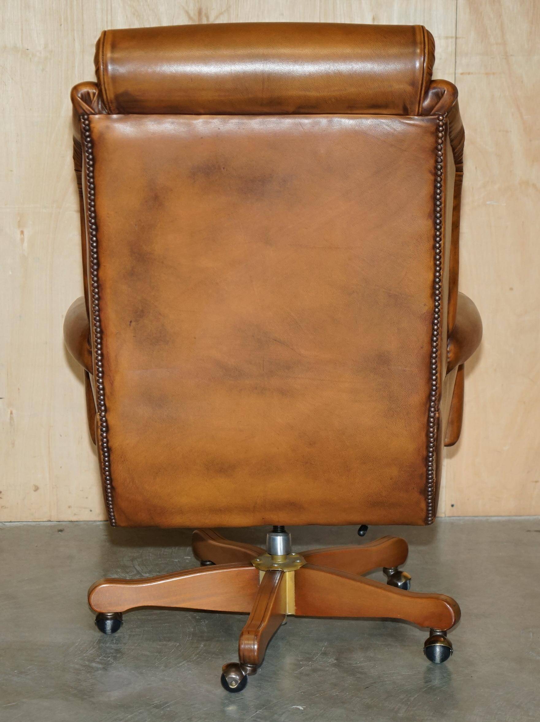 Captain's chair Chesterfield vintage leather with tufted wingback.