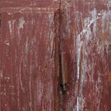 Rustic Parisian cabinet in pine wood with old burgundy paint layers, ca. 18