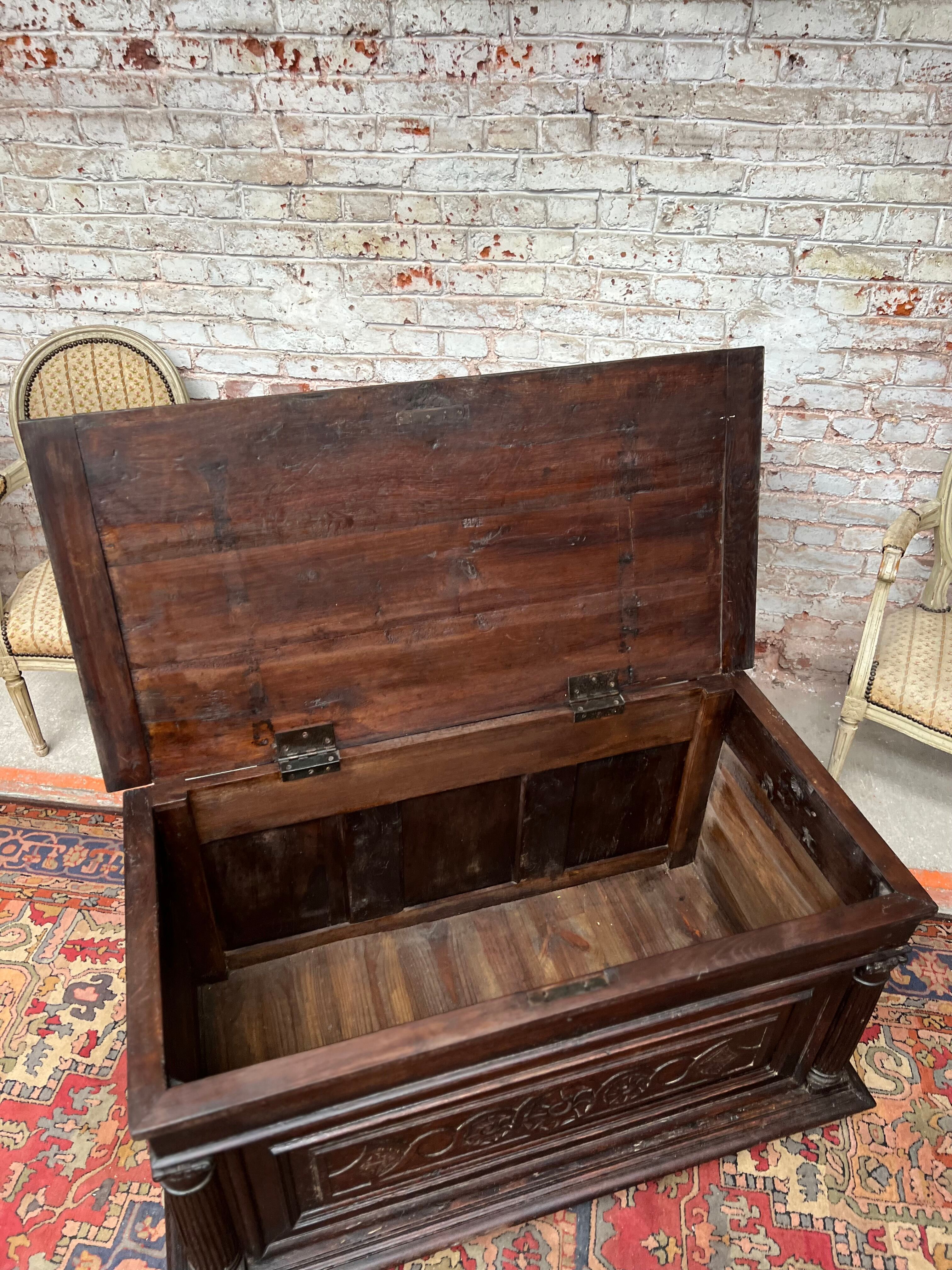 Chest in carved natural wood of the eighteenth century