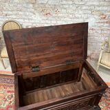 Chest in carved natural wood of the eighteenth century