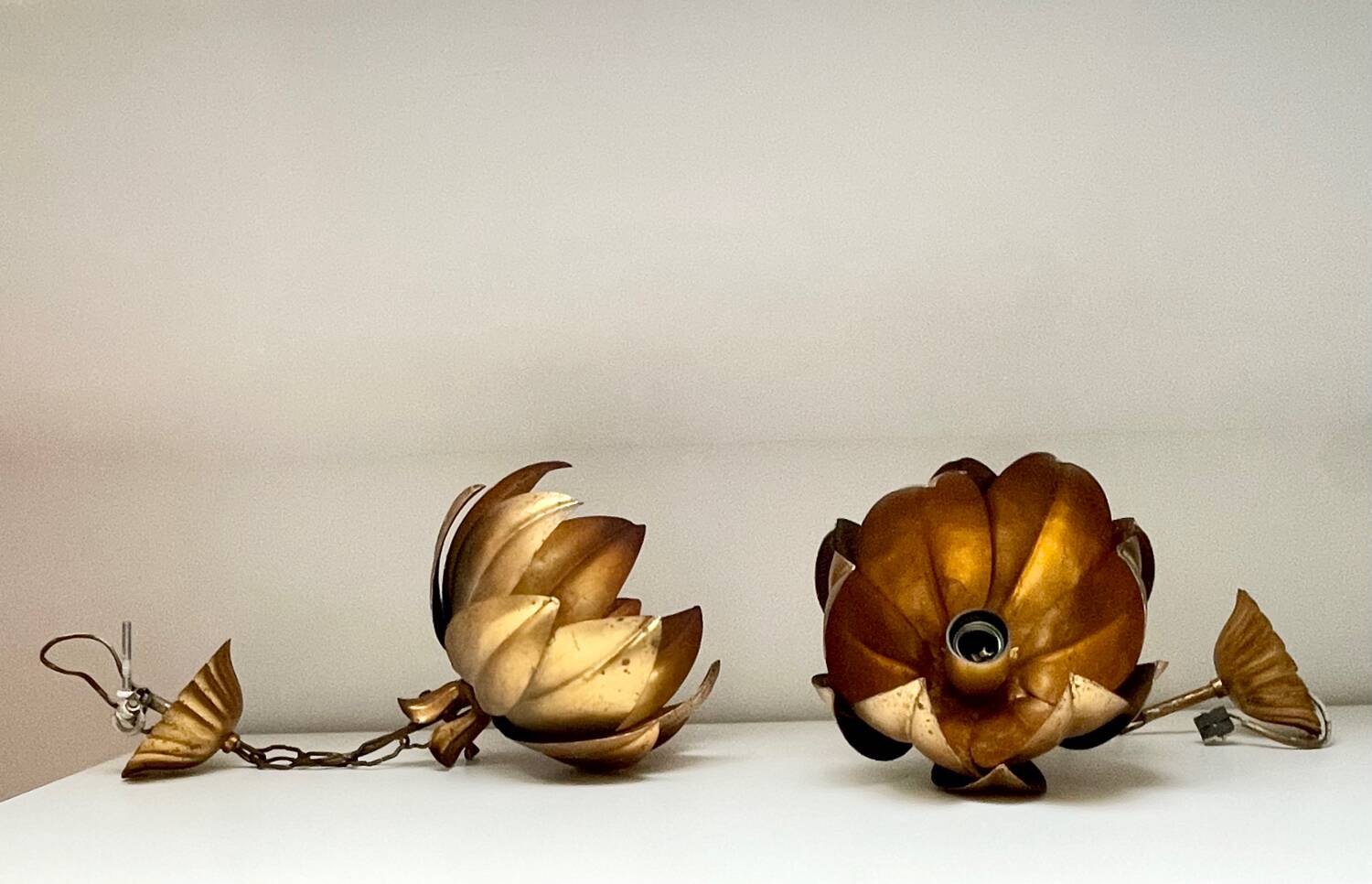 Two vintage pendant lights in gold metal