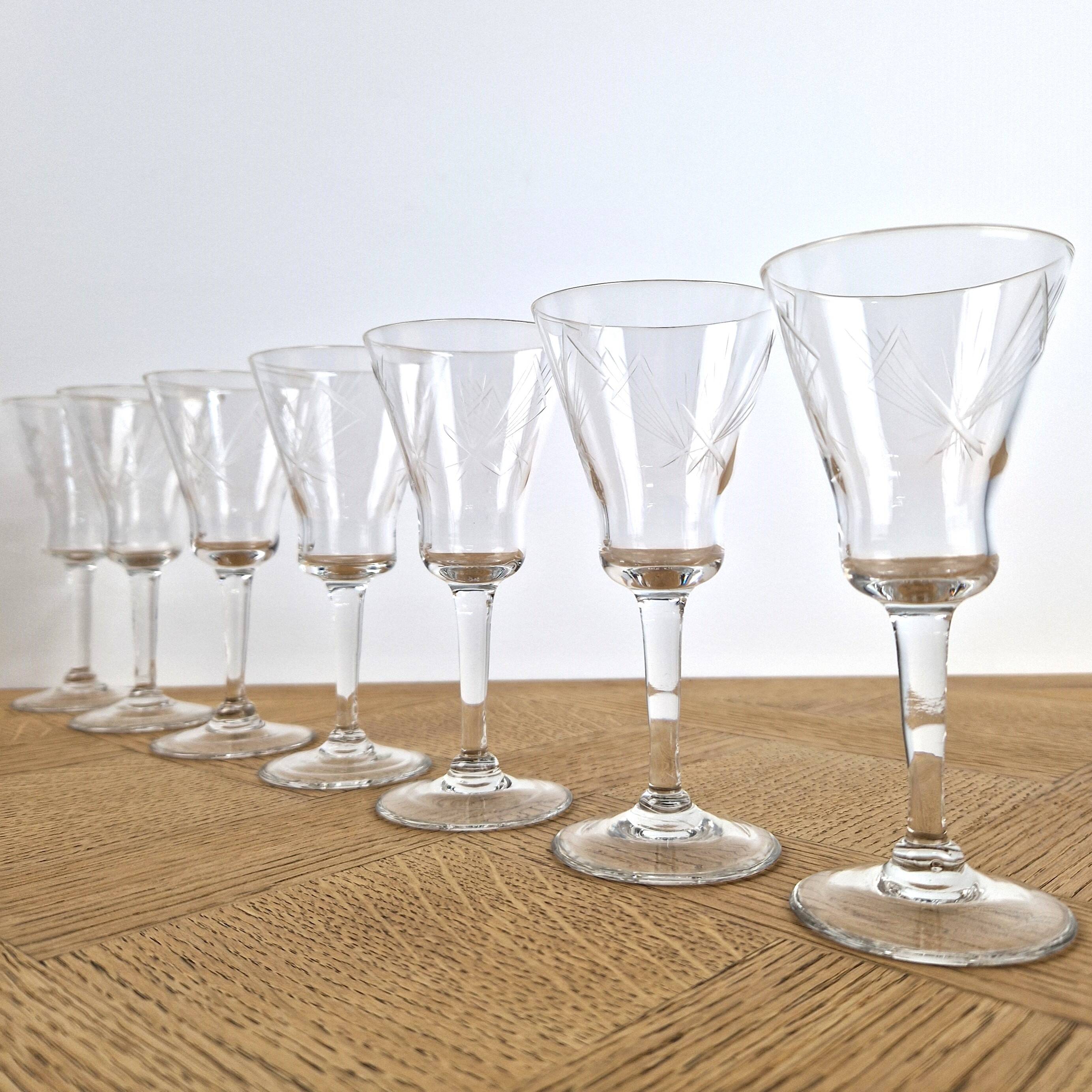 7 crystal footed glasses, antique white wine glasses.
