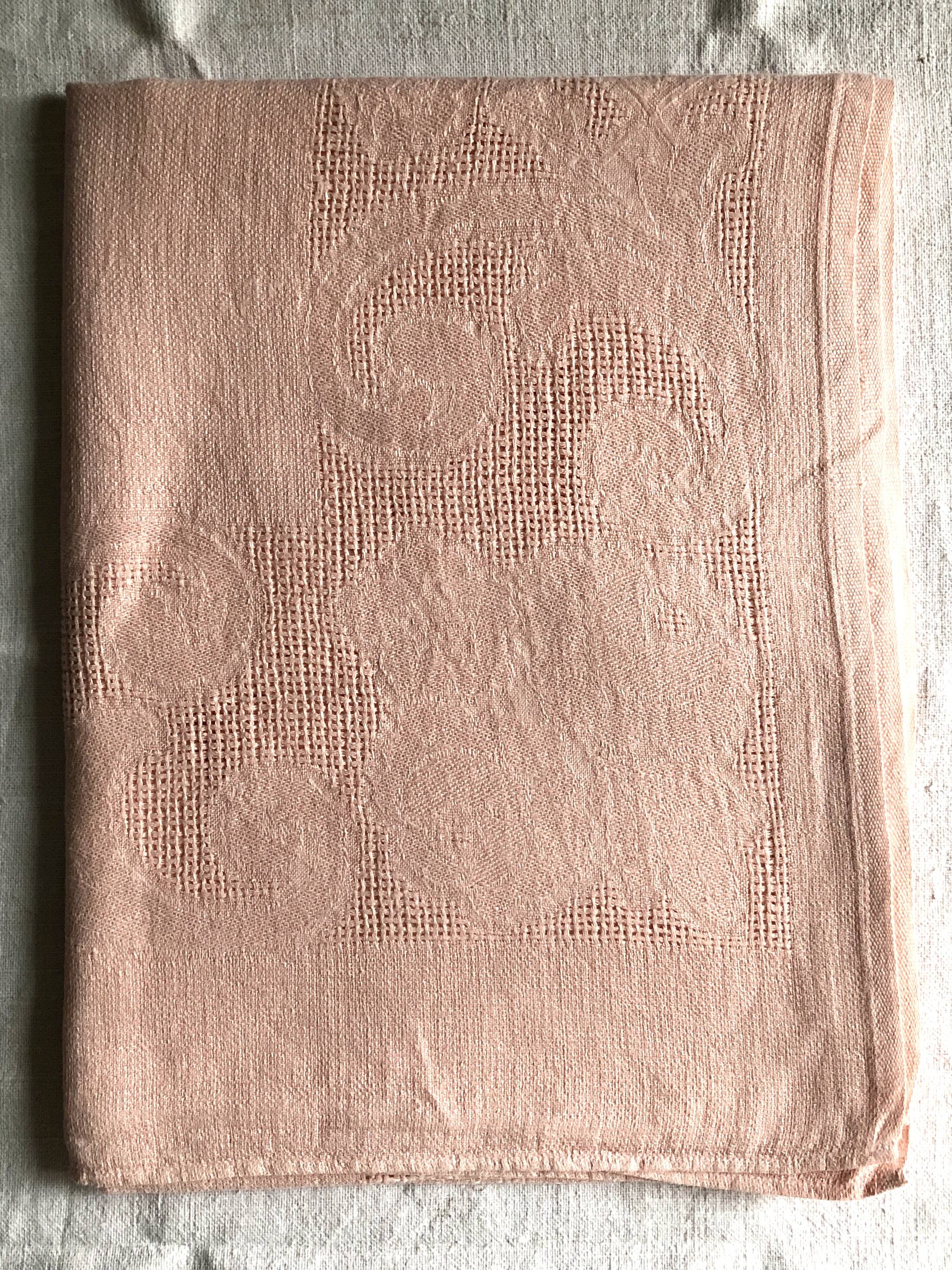 Antique tablecloth in pure linen tinted coral pink