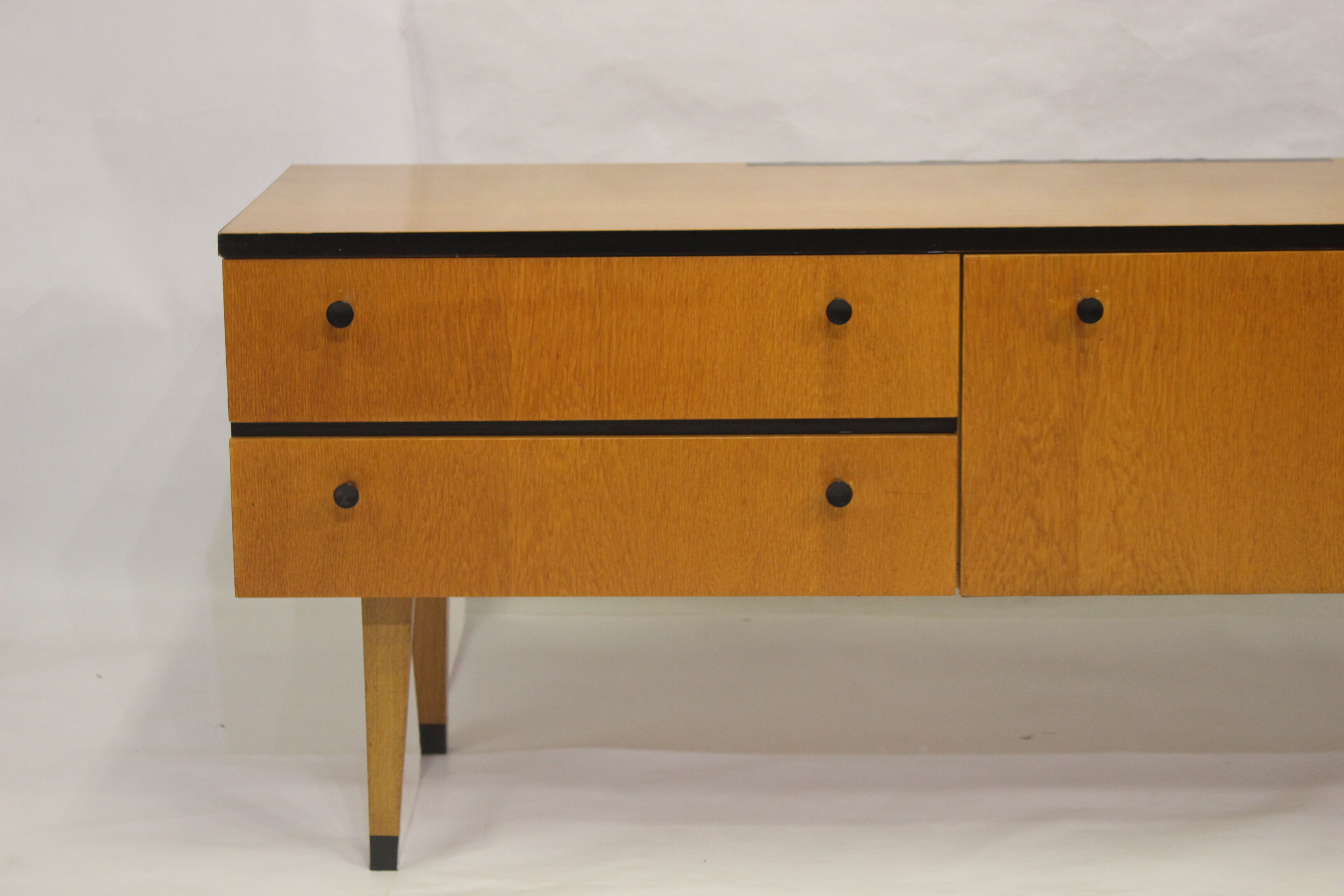 Black-gloved 50s varnished wooden sideboard