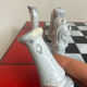 Chess set with ceramic board and pieces.