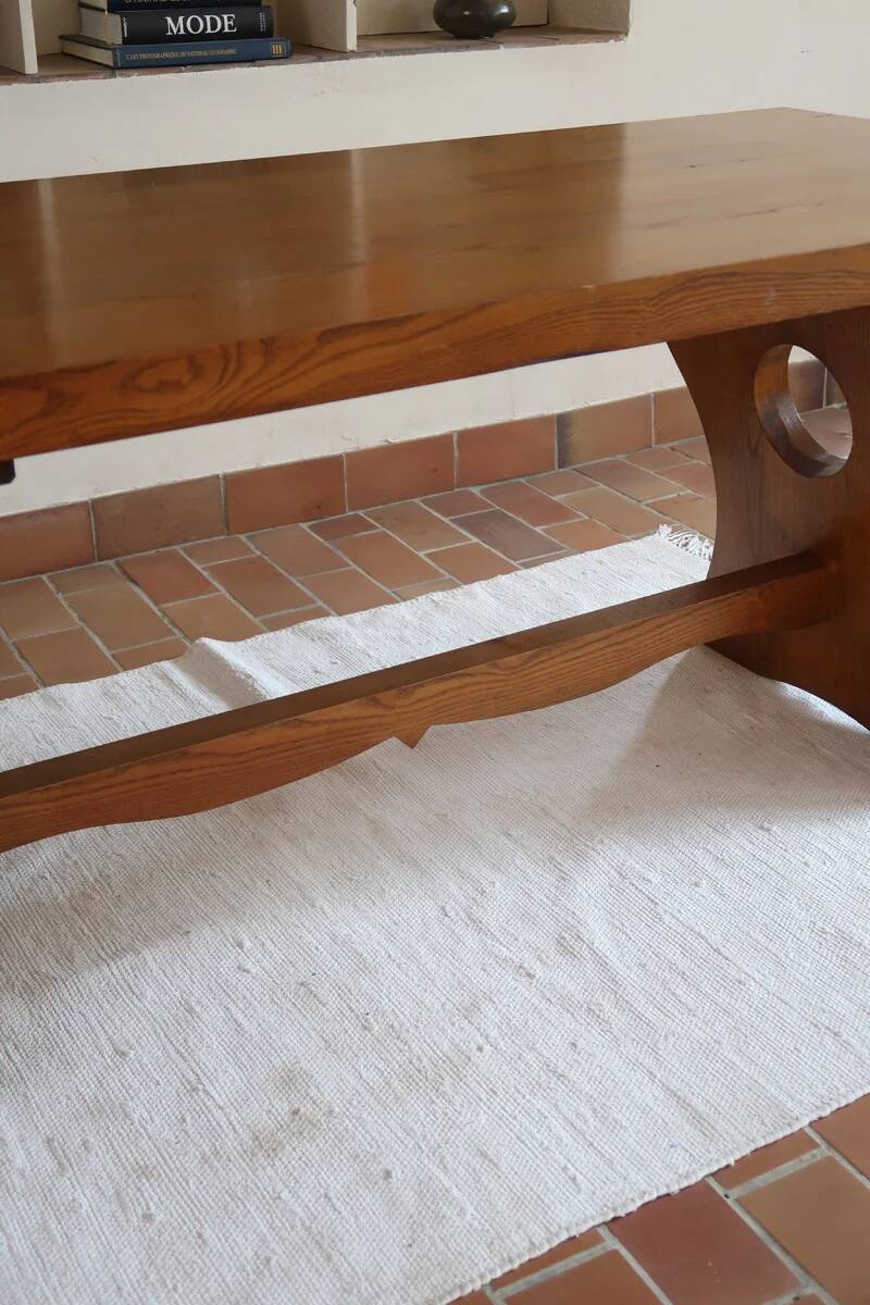 Solid wood dining table, sculpted brutalist base, 1960s.
