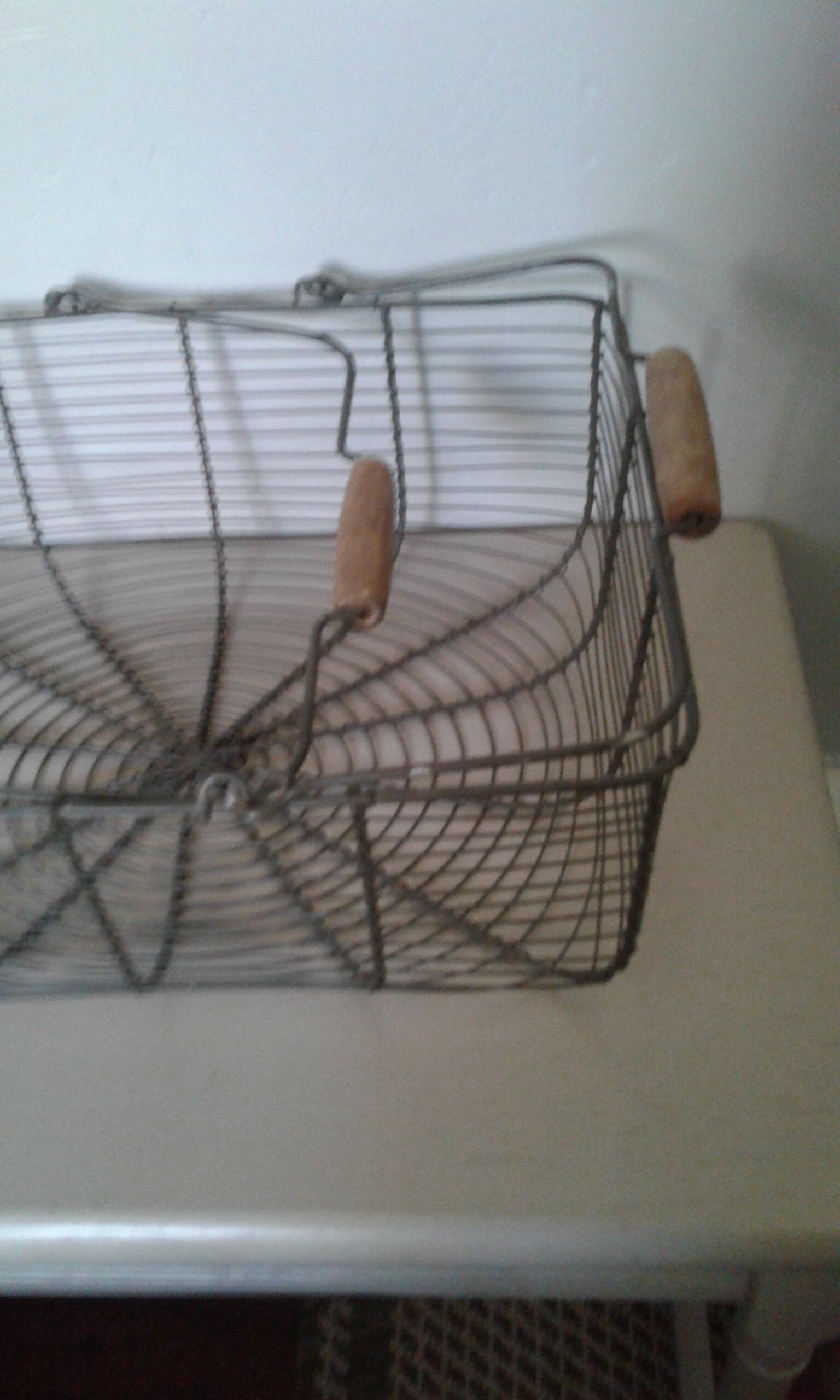 Metal basket with wooden handles