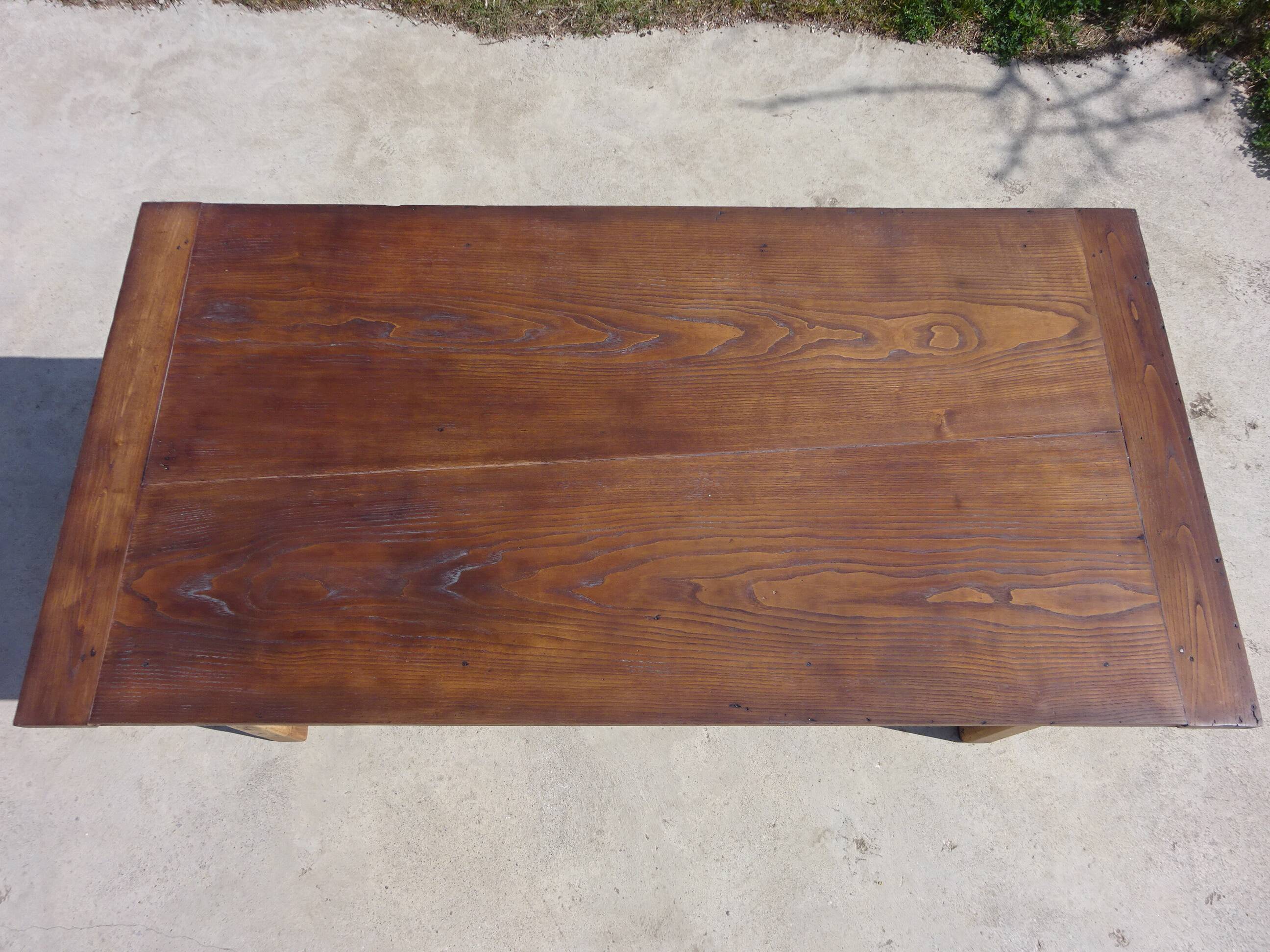 Old farmhouse table made entirely of restored solid oak.
