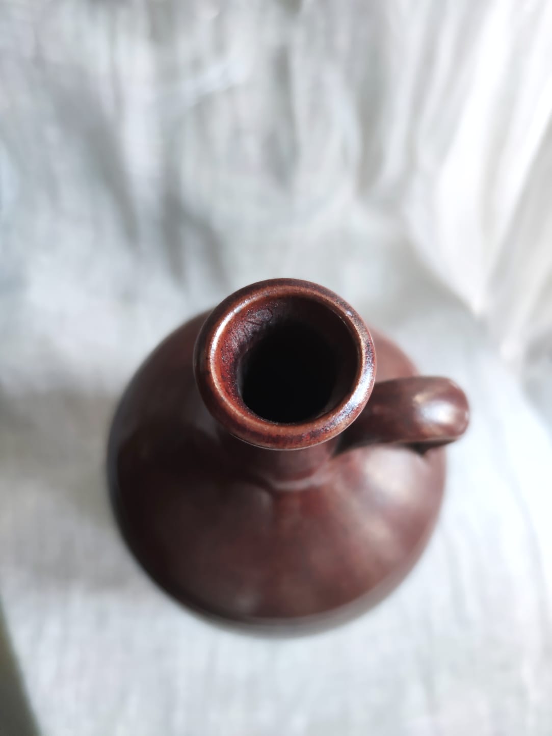 Large burgundy jar