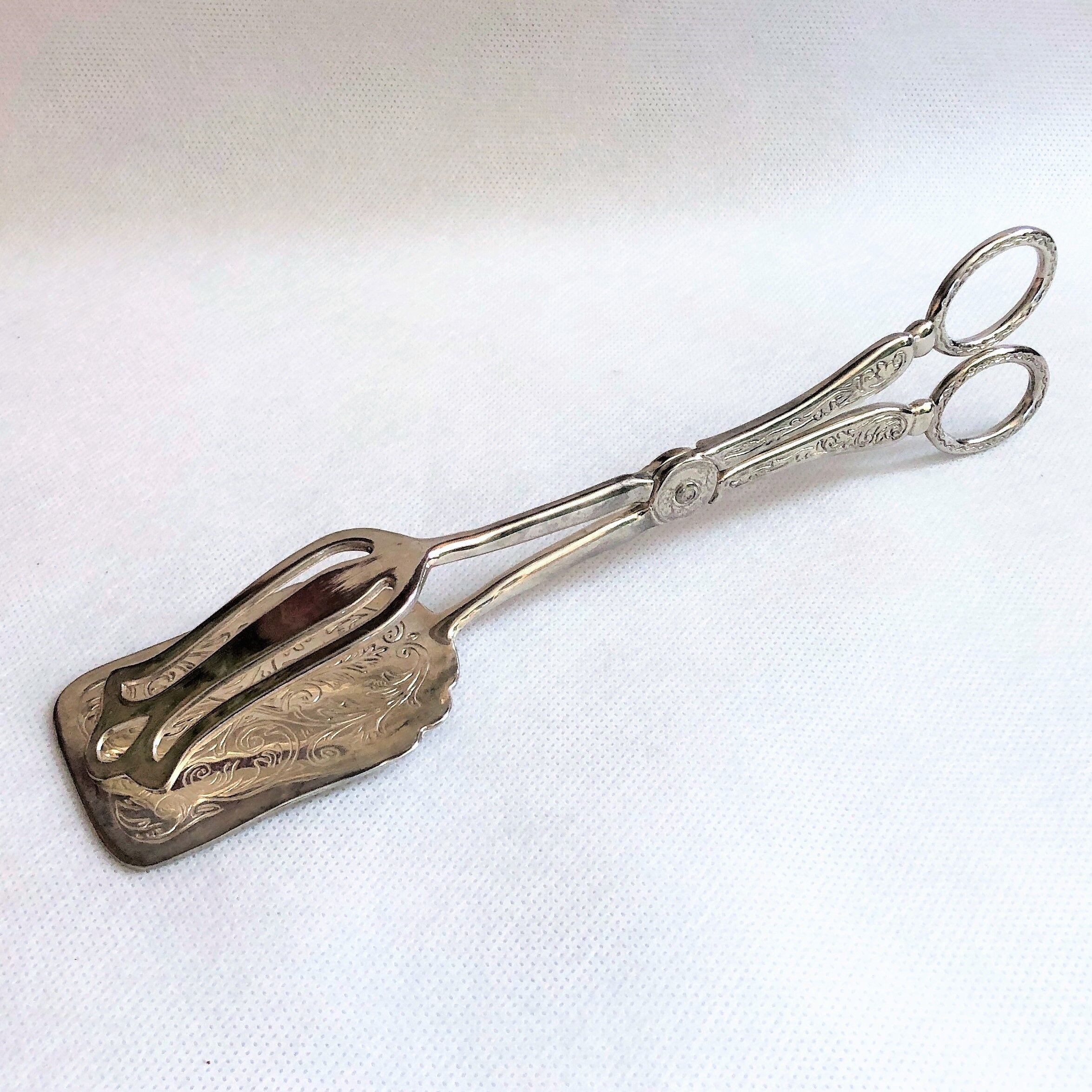 Wrought silver plated cake clips