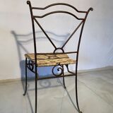 Wrought iron chair with woven seat