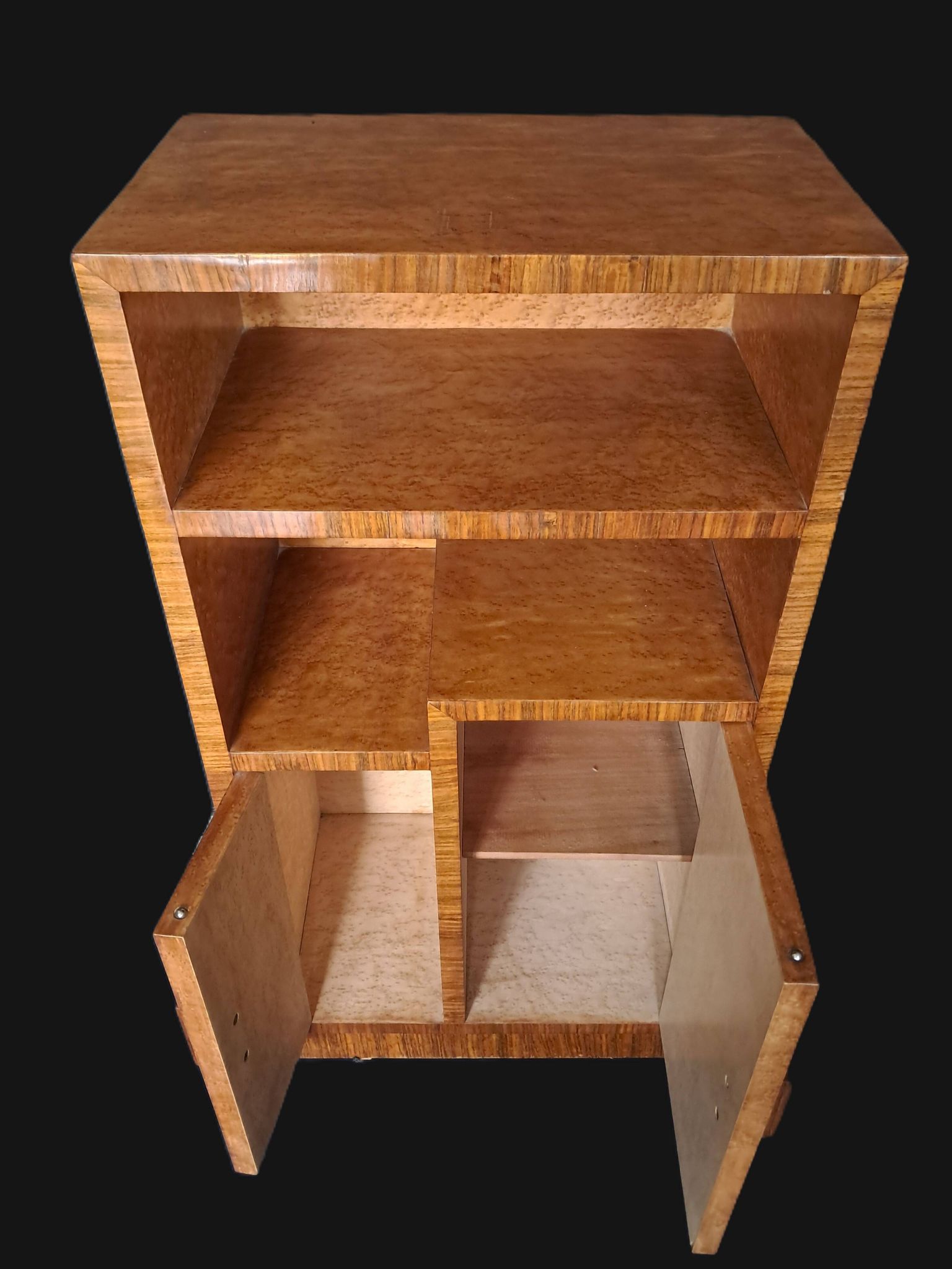 Art Deco cabinet in speckled maple veneer with asymmetrical shelves.