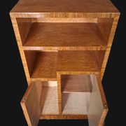 Art Deco cabinet in speckled maple veneer with asymmetrical shelves.