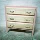 Vintage wooden and pink chest of drawers