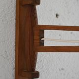 Wooden wall light with adjustable arm