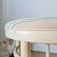 Vintage curved wooden stool in Baumann style, striped seat.