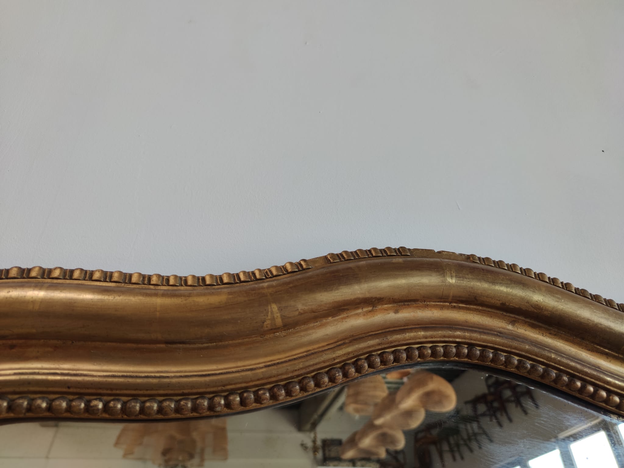 Louis Philippe gilded mirror with gendarme hat nineteenth H:130cm