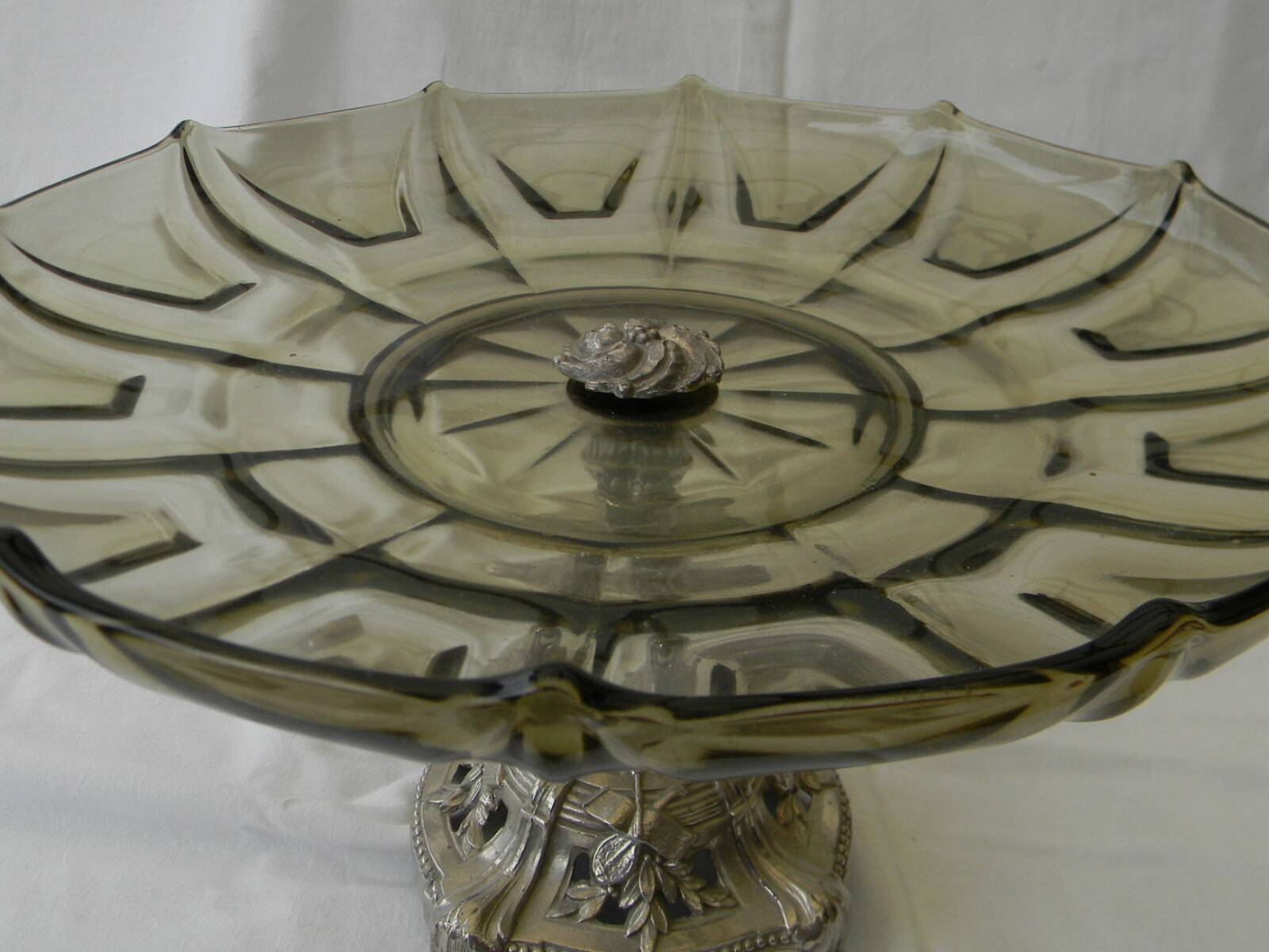 Large smoked glass fruit bowl with a metal base.