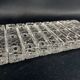 Set of 12 molded glass or crystal knife rests with diamond point decor