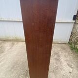 Oak two-column filing cabinet with curtains.