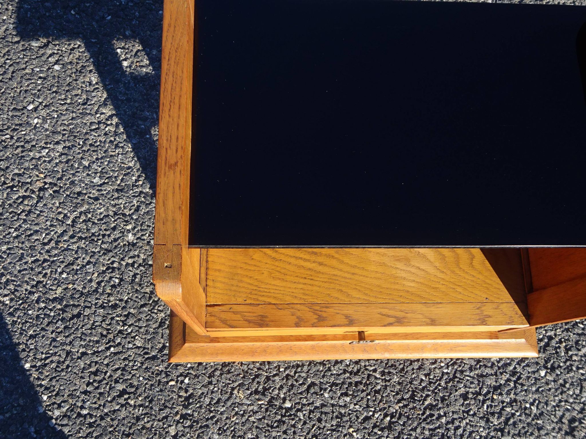 Vintage oak bedside table with tapered legs.