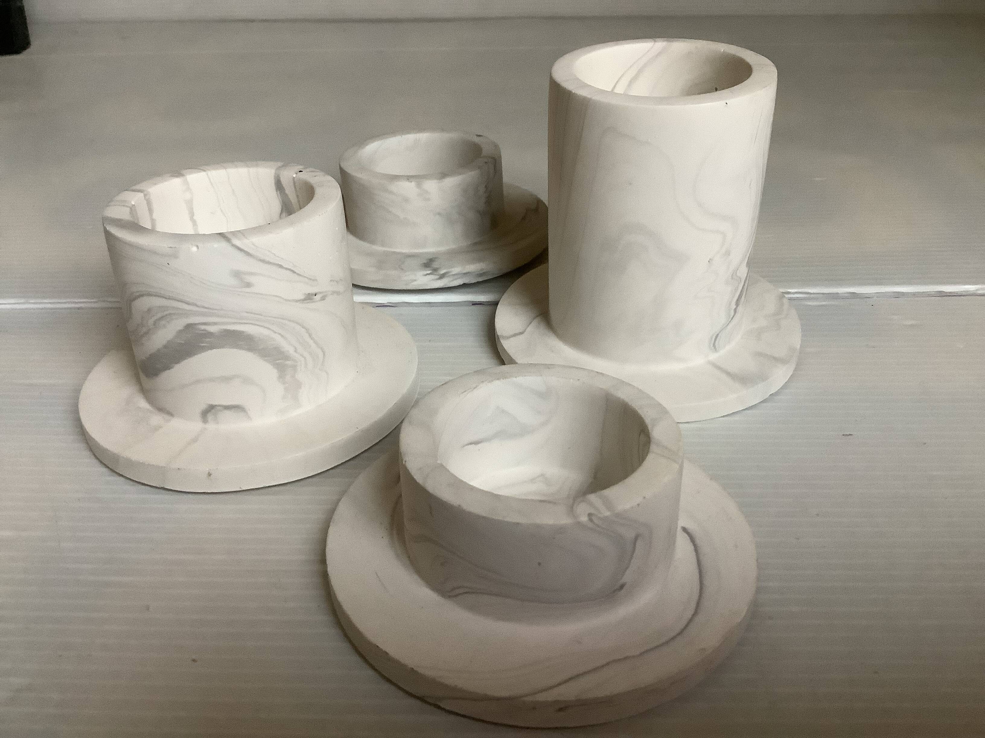 Four gypsum composite candle holders