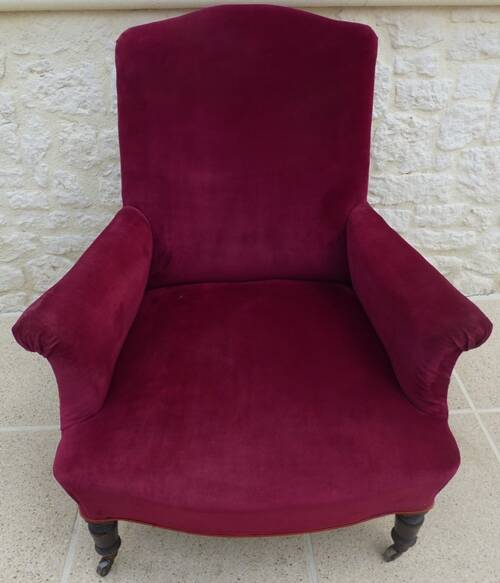 Bergère with blackened wooden legs on casters, Napoleon III period, velvet upholstery