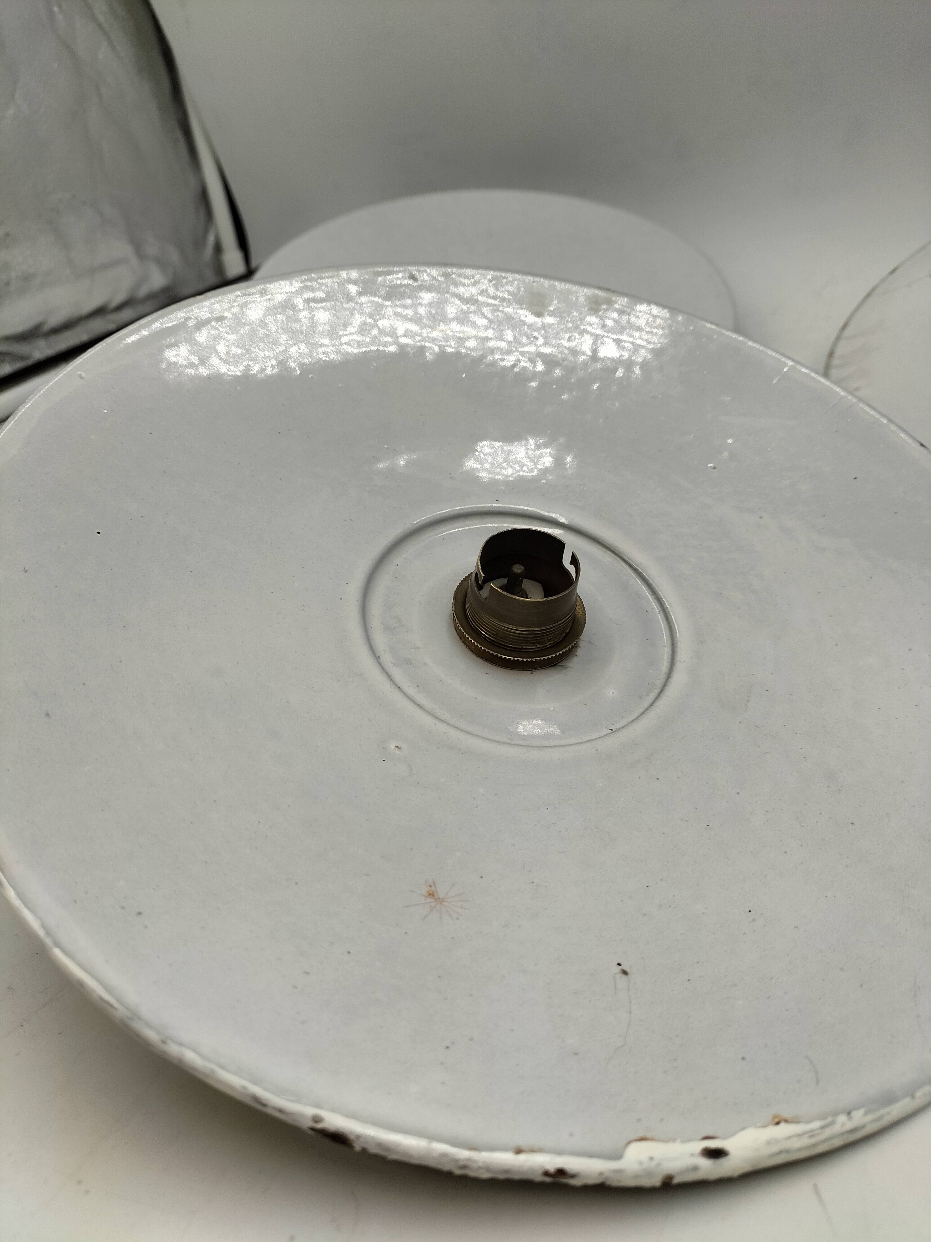 Three enamelled sheet metal suspensions