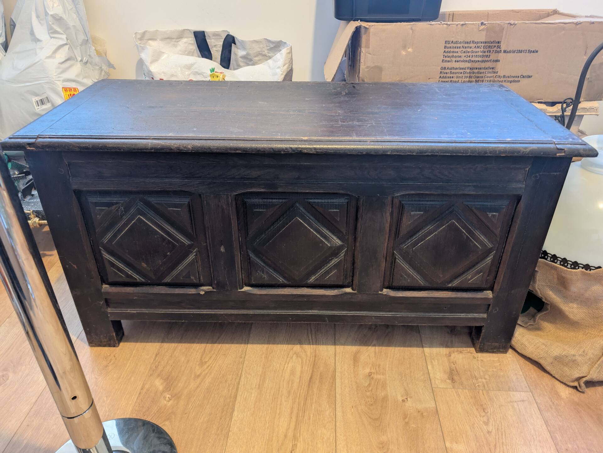 Antique dark wood chest with geometric paneling / pointed detail