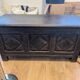 Antique dark wood chest with geometric paneling / pointed detail