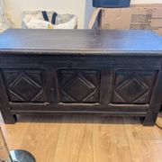 Antique dark wood chest with geometric paneling / pointed