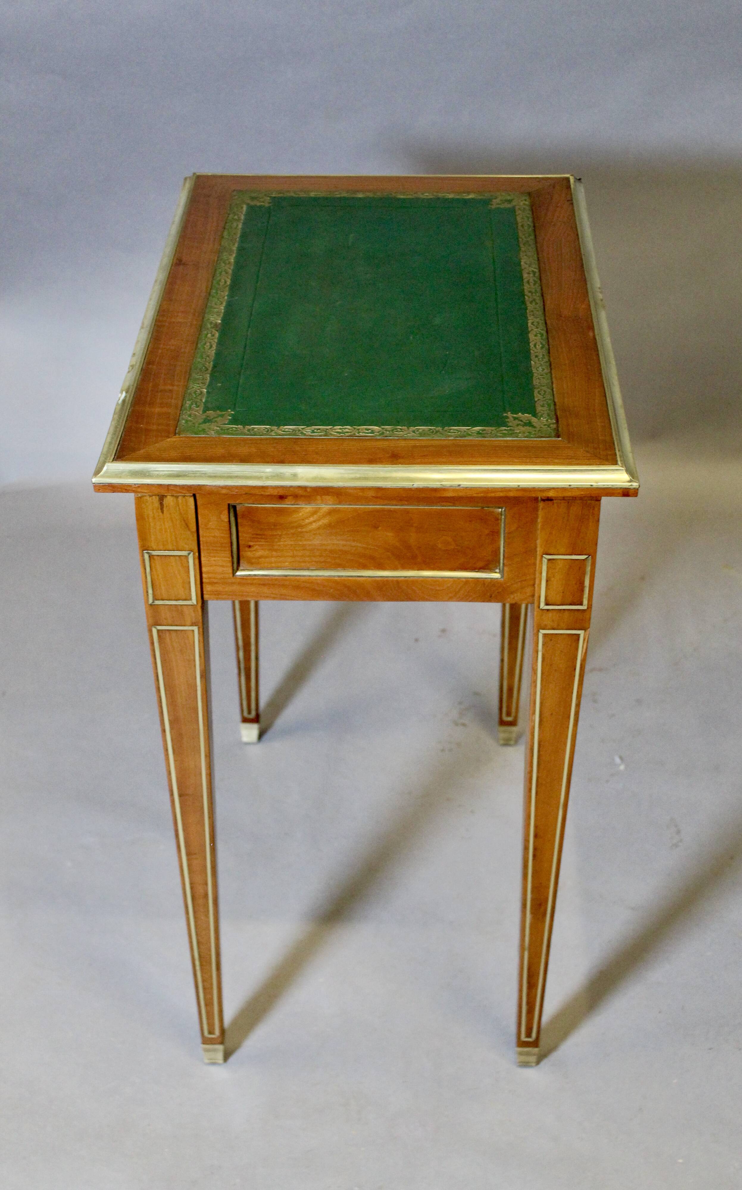 Louis XVI writing table with brass beading