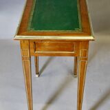 Louis XVI writing table with brass beading