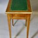 Louis XVI writing table with brass beading