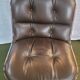 Charles Pollock armchair from the 80s – Leather, metal, plastic.