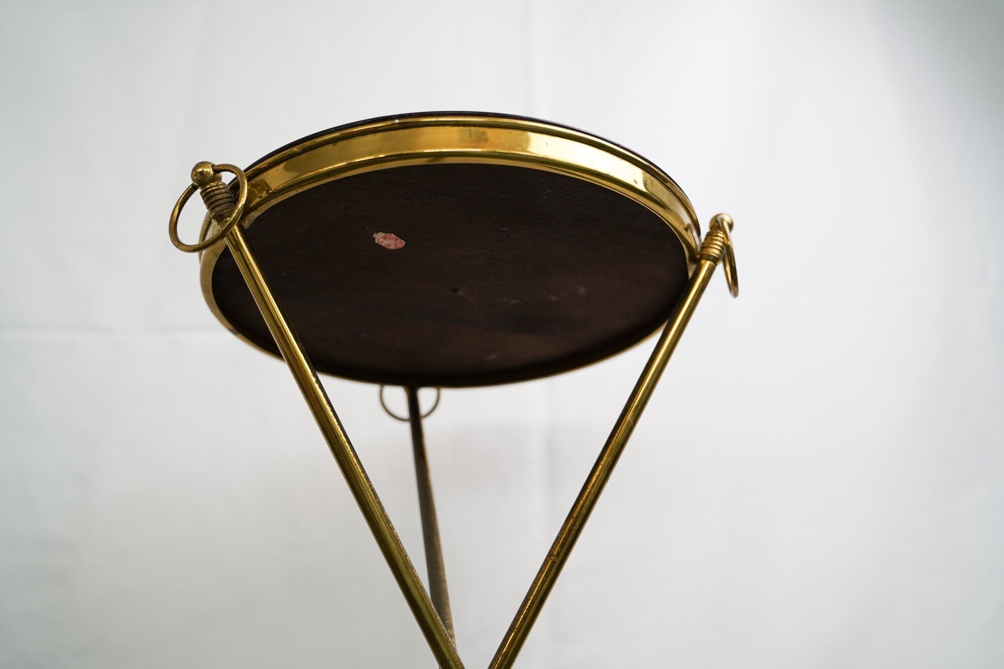 Small Italian brass and wood tripod coffee table from 50s
