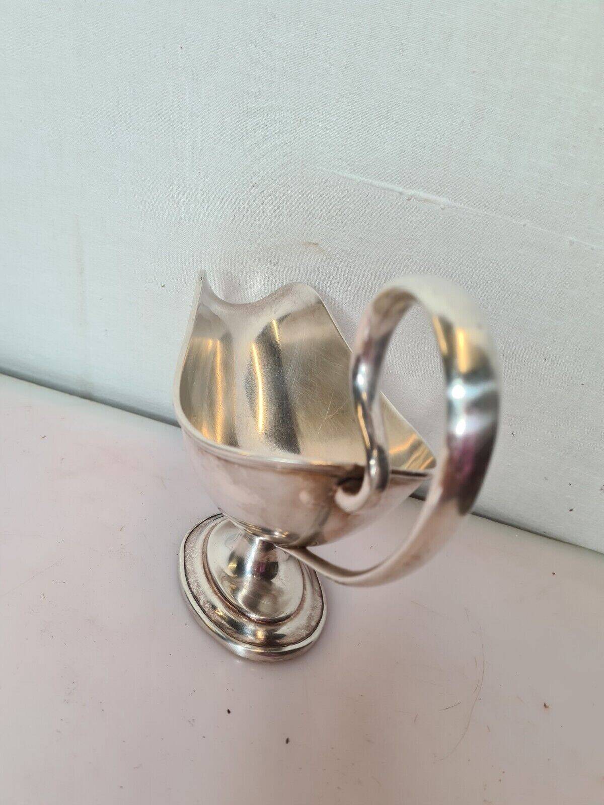 silver metal gravy boat