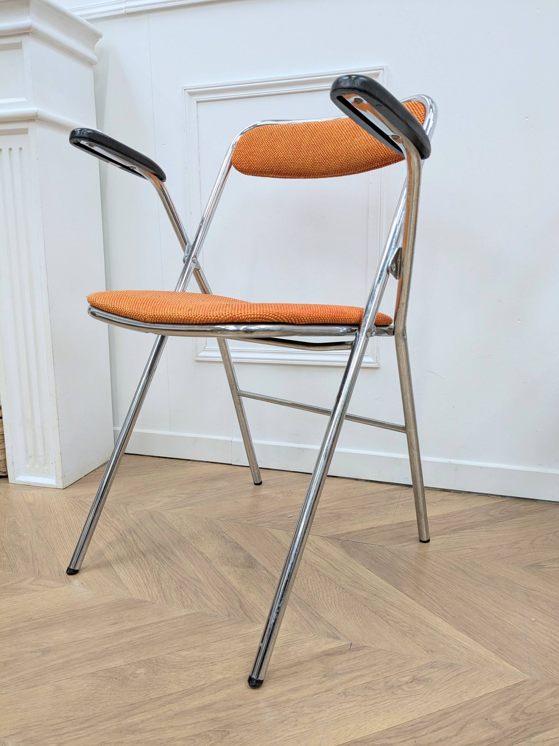 6 orange folding chairs