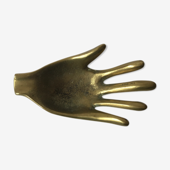 Empty hand-shaped brass pocket